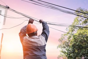 Electrician at risk of death of electrocution working on power lines